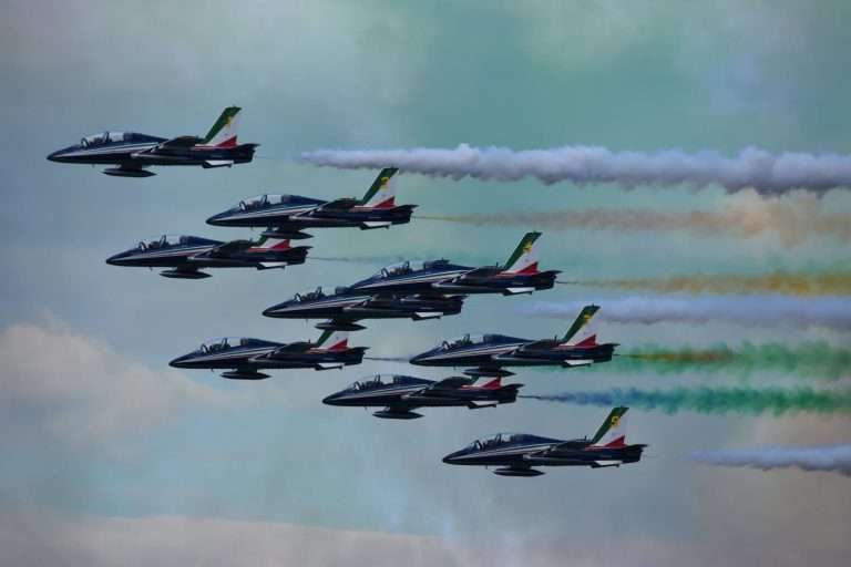 photo of jets with smoke trail